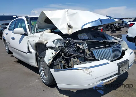 1999 Lincoln Town Car Cartier из США, поврежденный, VIN 1LNHM83W0XY716443